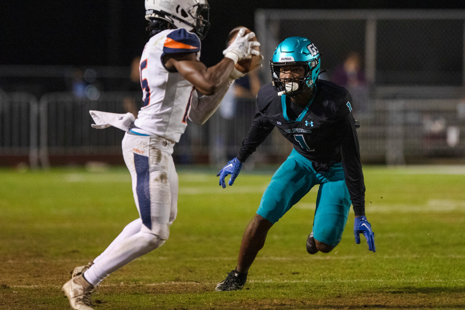 Dolphin senior Braden Jackson bears down on Trojan junior Kameron Johnson during Nov. 17’s second-round playoff game in Gulf Shores against Charles Henderson. Jackson caught a 31-yard touchdown pass in Friday’s state quarterfinal to help the Dolphins beat the Headland Rams 35-14.