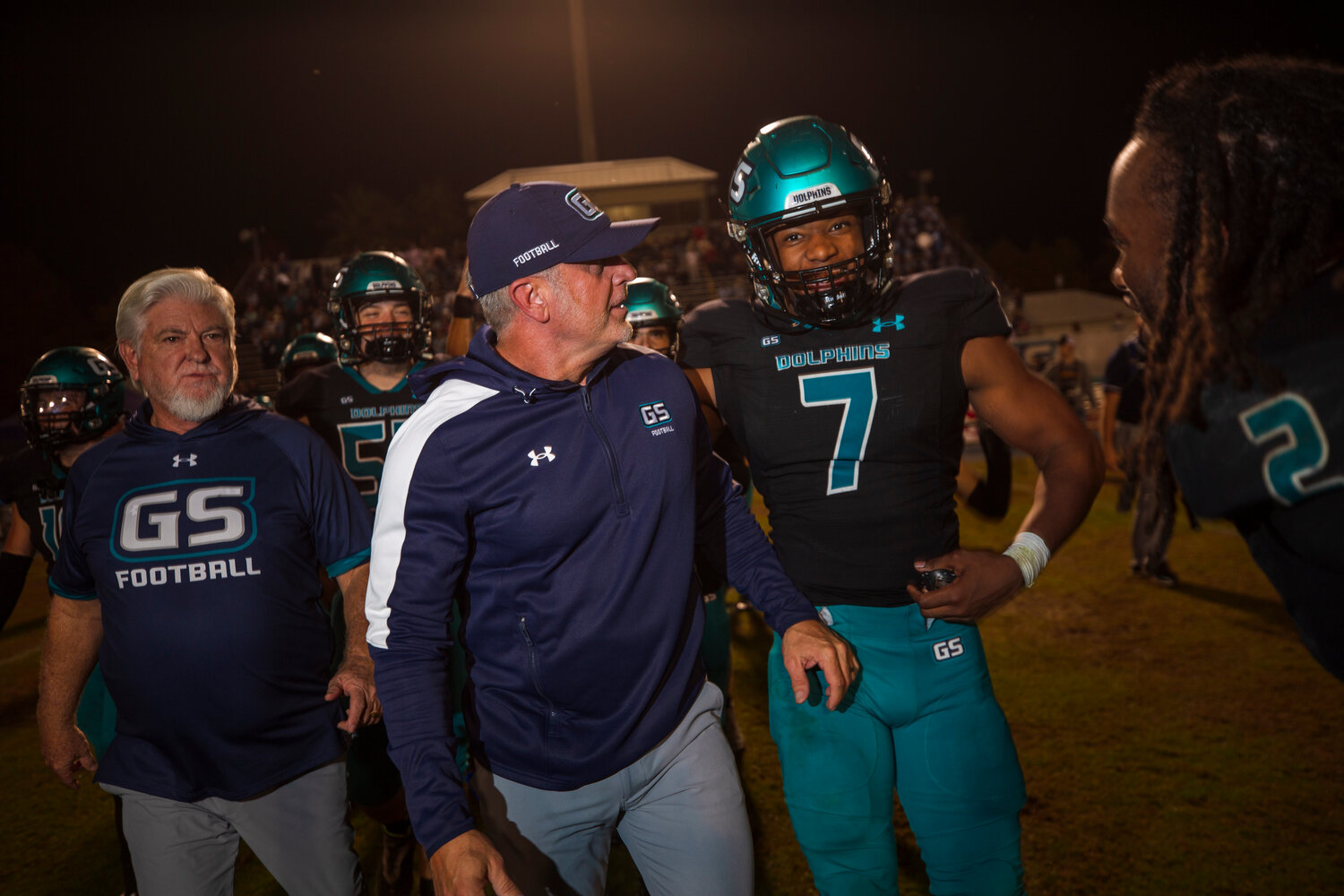 Gulf Shores head football coach Mark Hudspeth and sophomore Jamichael Garrett (7) react to the Dolphins’ second-round win over Charles Henderson at home on Nov. 17. Gulf Shores traveled to Headland Friday night and earned a 35-14 win to collect a program-record 13th victory of the season.