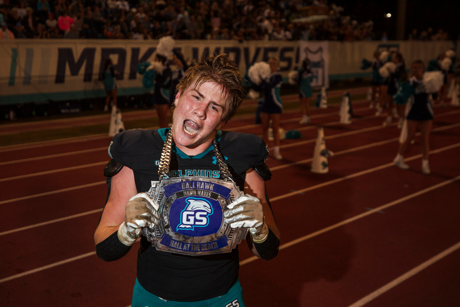 Dolphin sophomore Landon Everett flashes off the turnover chain after he supplied one of three pick-sixes in Gulf Shores’ second-round win over Charles Henderson on Nov. 17. Everett led the way with nine tackles in a 35-14 quarterfinal win over Headland Friday night.