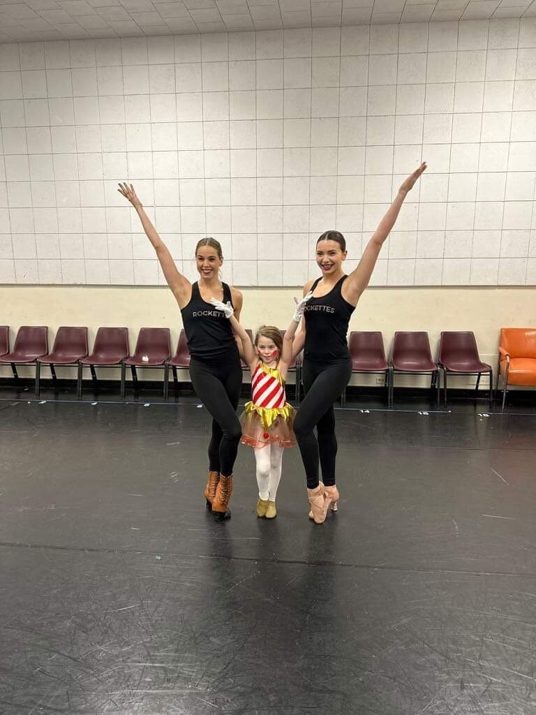 While at The Rockettes' annual holiday show, Clarke was surprised with a private dance class with The Rockettes themselves.
