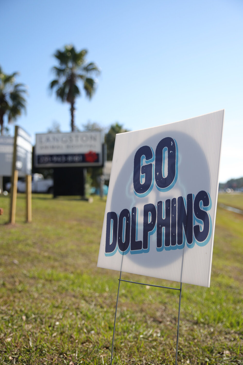 A sign outside of Langston Animal Hospital shows "Go Dolphins" in support of the GSHS football team as they get ready to compete in the semi-finals on Dec. 1.