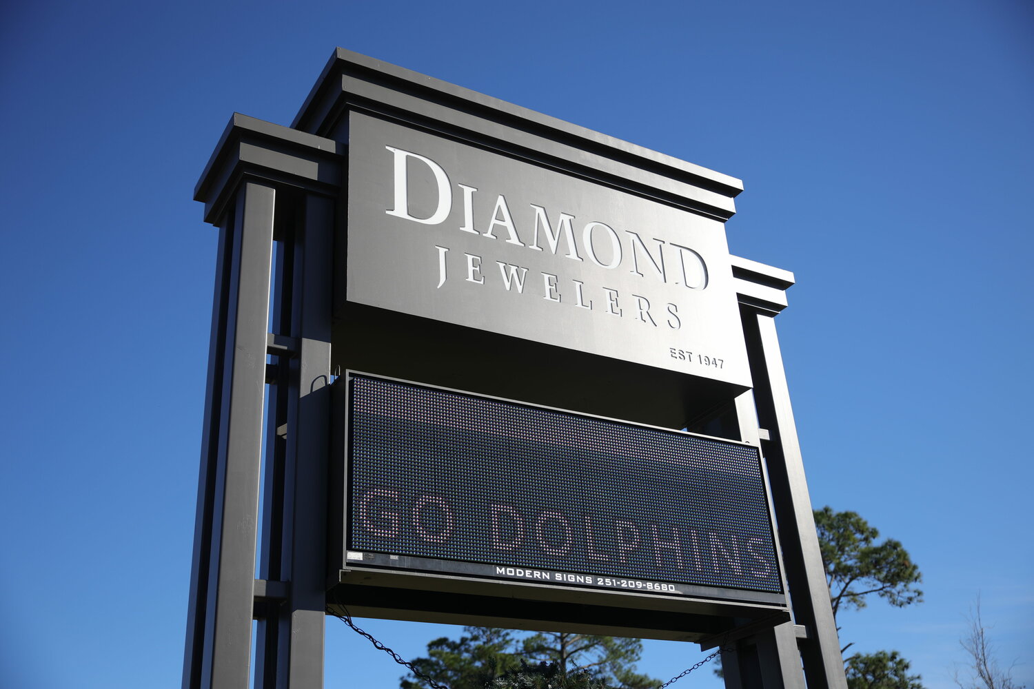 Diamond Jewelers showing their support for the GSHS football team by putting a graphic on their sign saying "Go Dolphins."