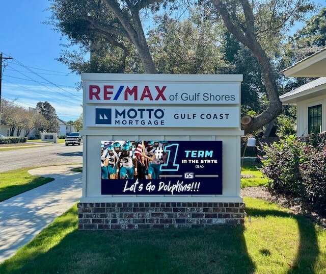 Remax of Gulf Shores features a graphic on their digital sign showing support of the GSHS Dolphins football team.