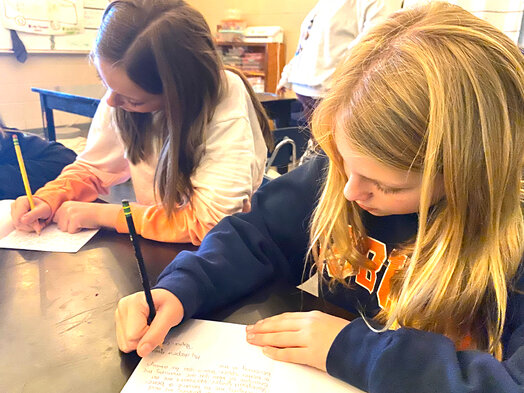 Three of Corbitt's students; Madison Willis, Marley Pierce and Emma Franks, write letters to a teacher or staff member who they are thankful for.