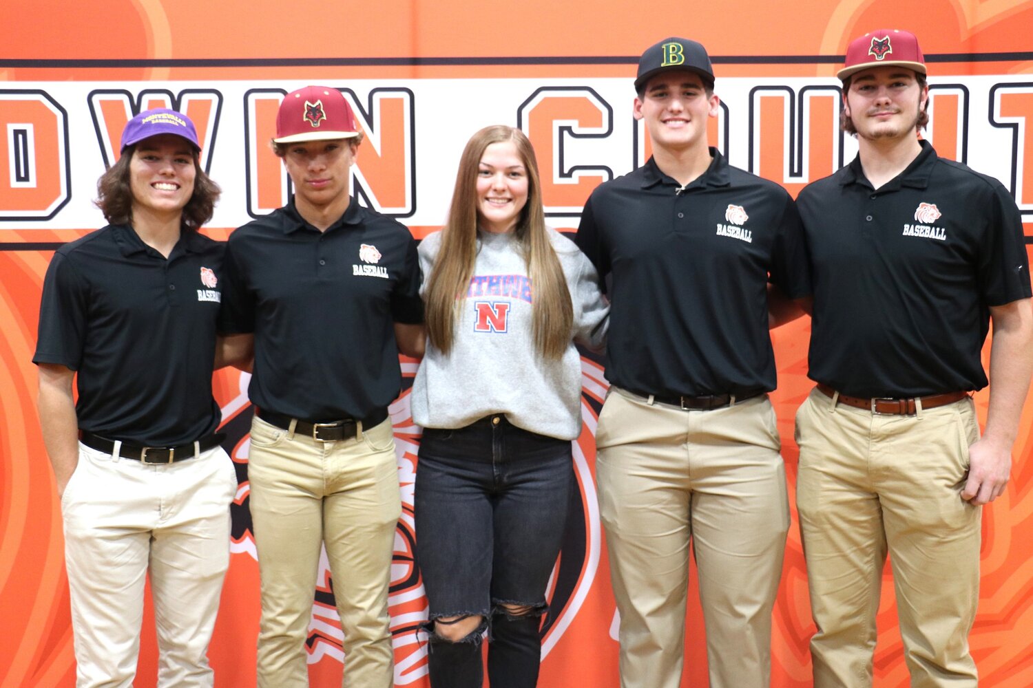 Baldwin County High School hosted a signing ceremony on Wednesday, Dec. 6, where four baseball players and one volleyball player inked college commitments. Pictured from the left are Landon Walker, Quincy Walters, Saylor Bryant, Jaxon Schuler and Eli Woody.
