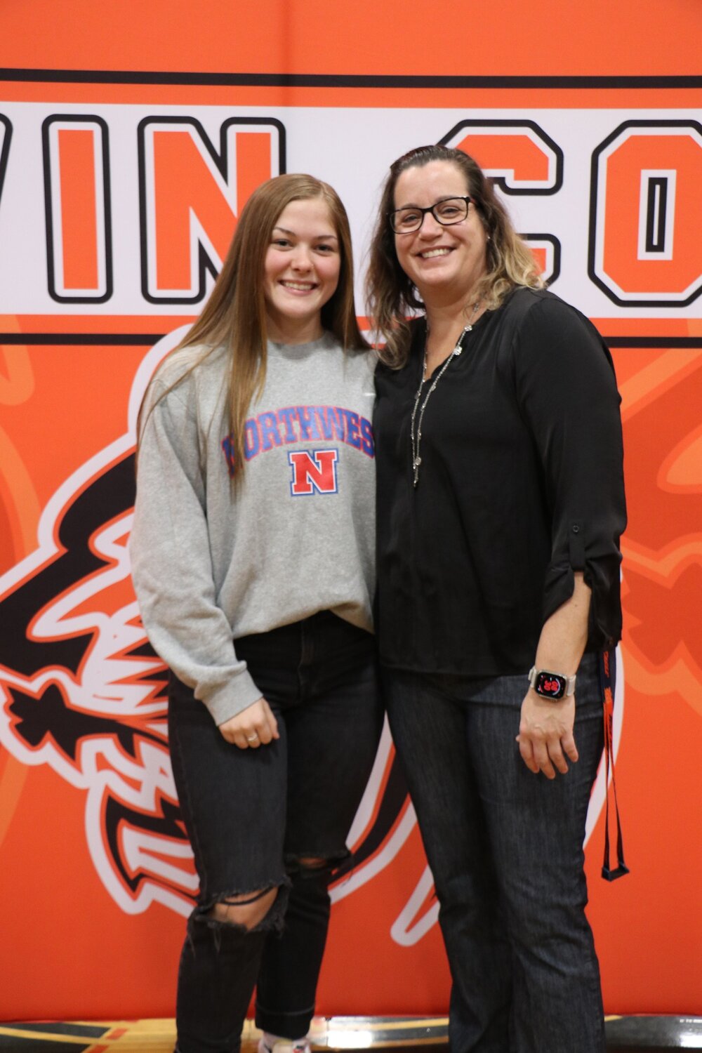 Senior Saylor Bryant and Baldwin County head volleyball coach Betty Heaton pose for a picture during the signing ceremony on Wednesday, Dec. 6, where Bryant sealed her pledge to play volleyball at Northwest Mississippi Community College.