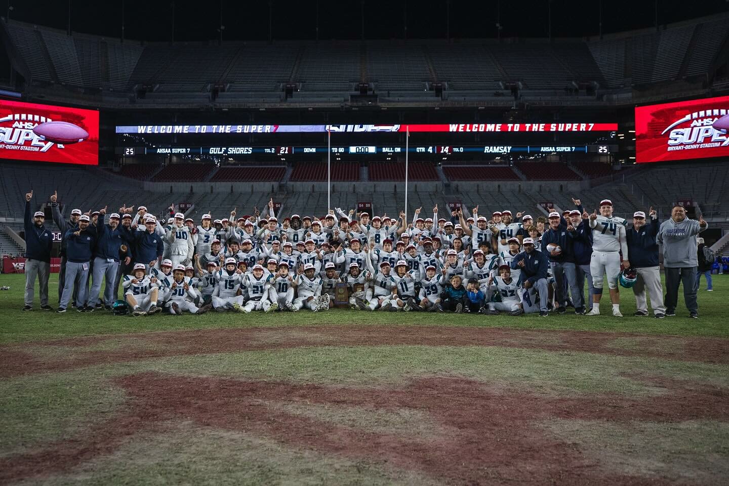 The Gulf Shores Dolphins pose for a picture after winning the AHSAA Class 5A State Championship at Tuscaloosa’s Bryant-Denny Stadium on Thursday, Dec. 7. Gulf Shores beat defending champion Ramsay 21-14.