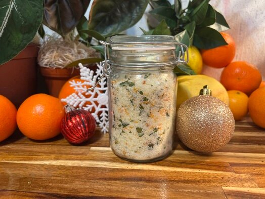 Create a custom citrus herb salt blend by combining dried citrus zest with sea salt and herbs like rosemary or thyme. Present it in a decorative salt grinder or small jars.