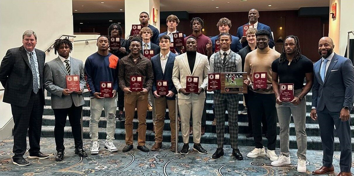 The top football players in the state were recognized on Tuesday, Jan. 30, at the Alabama Sportswriters Association’s Mr. Football Luncheon held at Montgomery’s Renaissance Hotel and Convention Center. Pictured in the front row, from the left, are Joah Johnson, ALFA Senior Vice President, Strategic Marketing; Tim Parnell, Leroy (1A Lineman); D.J. Barber, Clay-Chalkville (6A Lineman); Alvin Henderson, Elba (1A Back); Jacob Cornejo, Cherokee County (4A Back); Q.B. Reese, Ramsay (5A Lineman); Ryan Williams, Saraland (Mr. Football and 6A Back); Bradley Shaw, Hoover (7A Lineman); Ronnie Royal, Gulf Shores (5A Back) and Brandon Dean, AHSADCA Director. Pictured in the back row, from the left, are Kentonio Kelly, Mobile Christian (3A Lineman); Joseph Phillips, B.T. Washington-Tuskegee (4A Lineman); Clayton Hussey, Lowndes Academy (AISA Back); Jay Lindsey, Patrician Academy (AISA Lineman); Cam Coleman, Central-Phenix City (7A Back); Preston Lancaster, Tuscaloosa Academy (2A Back); Tucker Wilks, Fyffe (2A Lineman) and the father of K.J. Jackson, Saint James (3A Back).