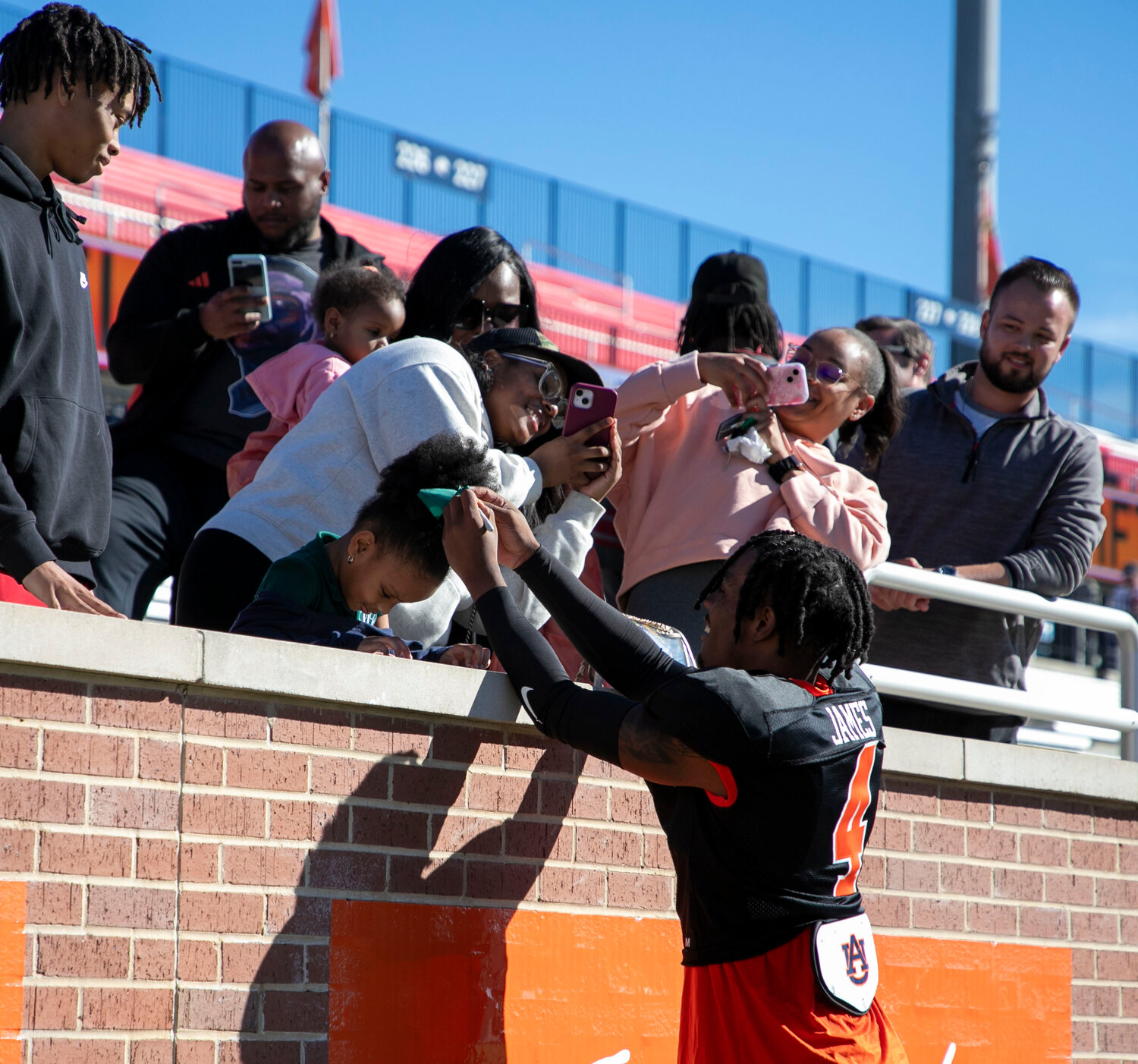 DJ James signs an autograph after Wednesday’s Senior Bowl practice on Wednesday, Jan. 31, at Hancock Whitney Stadium.