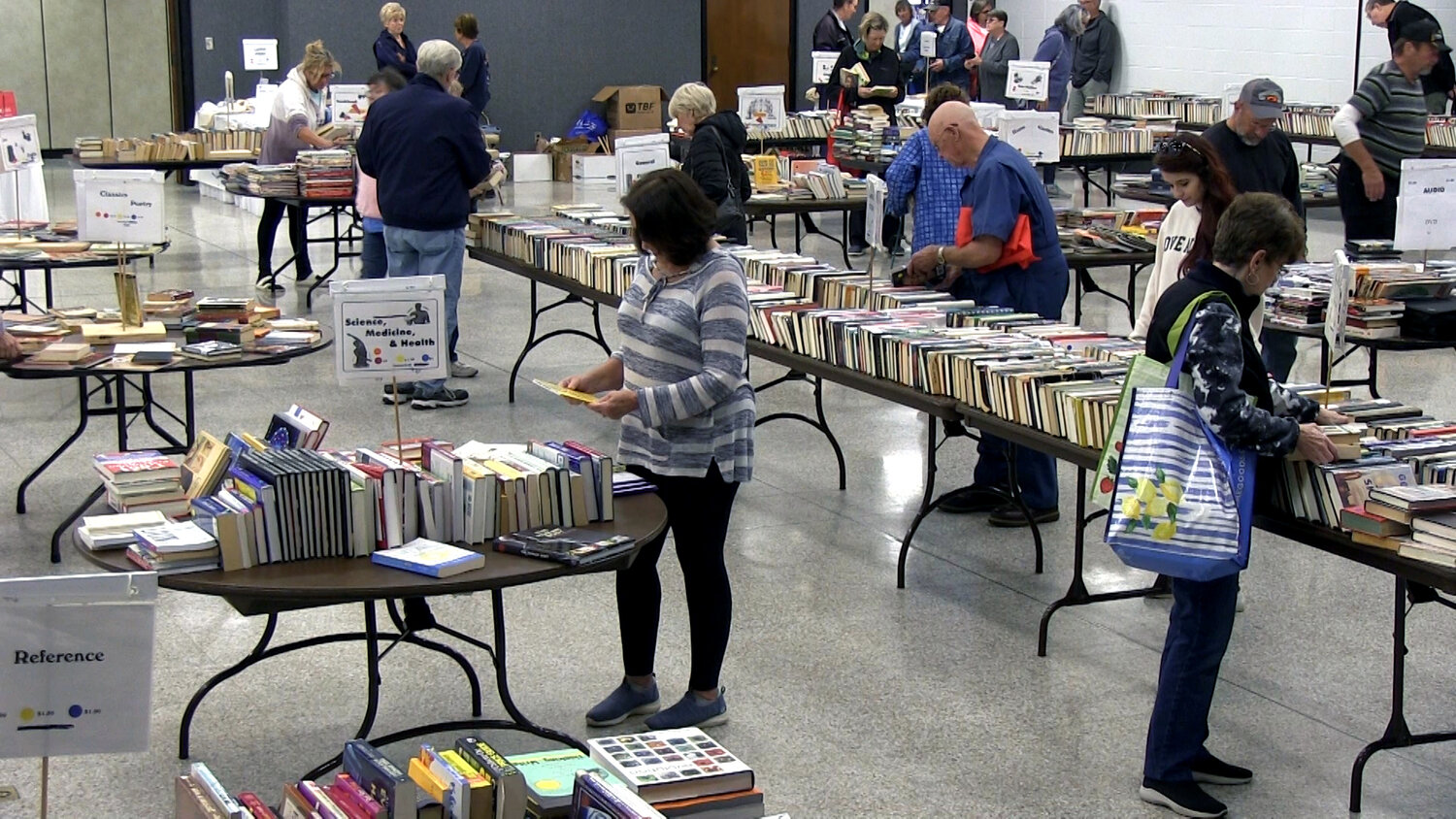 Attendees browse through the vast selection of books during the Friends of the Foley Library Book Sale. Mark your calendars for the 2024 sale, happening on Feb. 8, 9, and 10 at the Foley Civic Center.