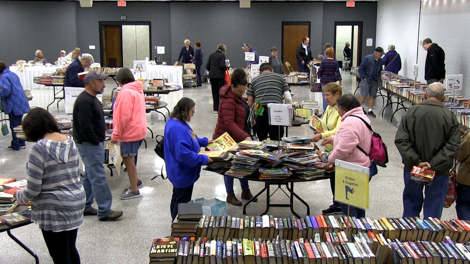 Attendees browse through the vast selection of books during the Friends of the Foley Library Book Sale. Mark your calendars for the 2024 sale, happening on Feb. 8, 9, and 10 at the Foley Civic Center.