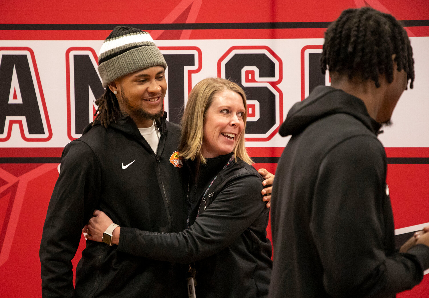Kris Abrams-Draine is greeted by Spanish Fort principal Shannon Smith, who started at her position on The Hill when Abrams-Draine was a junior. The former Toro was recognized alongside DJ James on Friday, Feb. 2, with a Spanish Fort Day where they returned to campus and spoke with active football players.