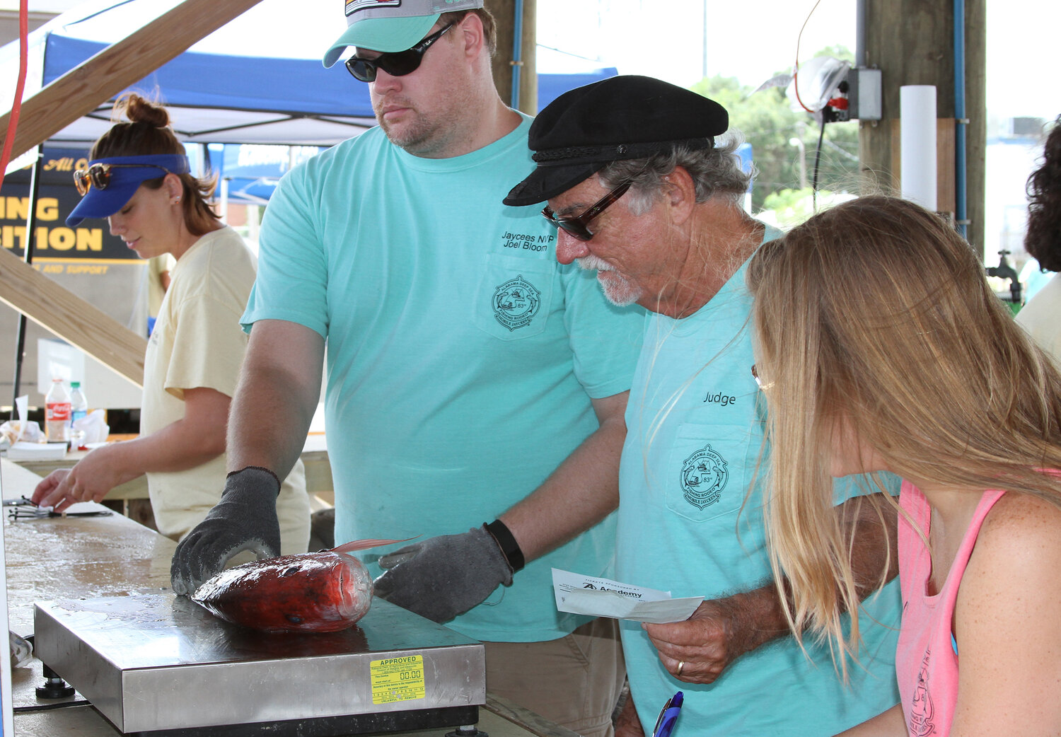As head rodeo judge, Shipp weighs in another of Alabama's signature fish, the red snapper.