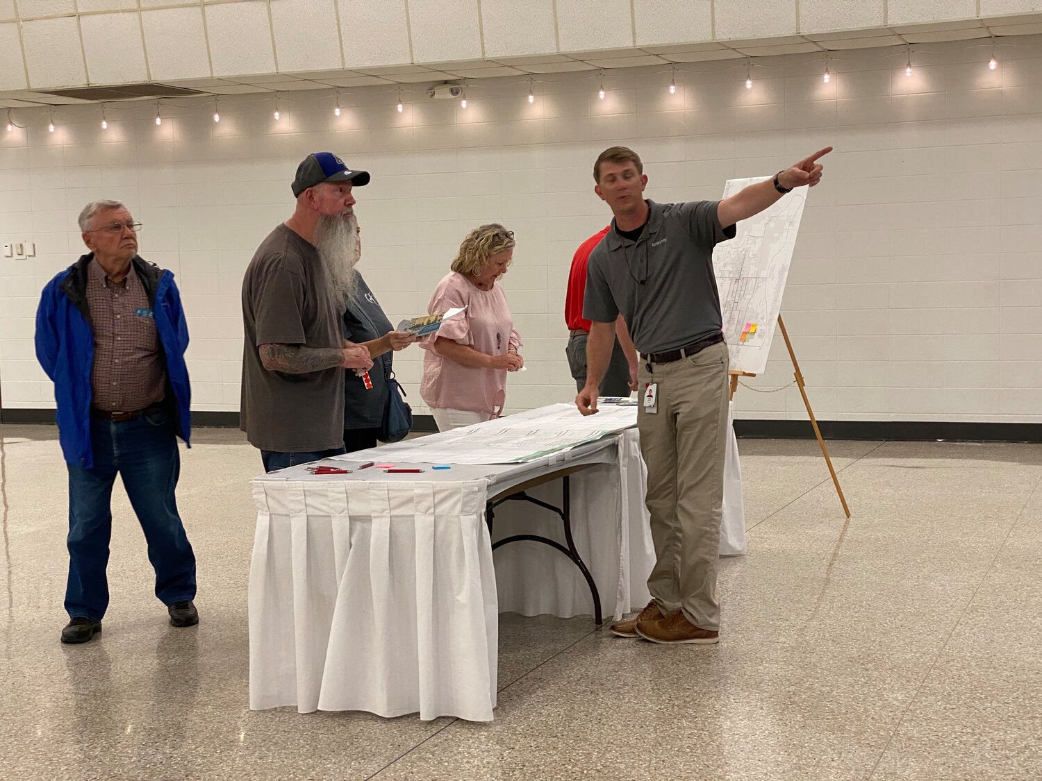 Residents and officials look over proposals for a traffic safety plan being developed for the city of Foley. The plan includes proposals for improvements along highways and major roadways in the city.
