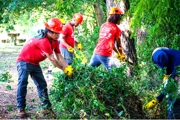 The 2022 GulfCorps orientation at the Beckwith Camp and Conference Center in Fairhope included removing invasive species during the Service Project Field Day.