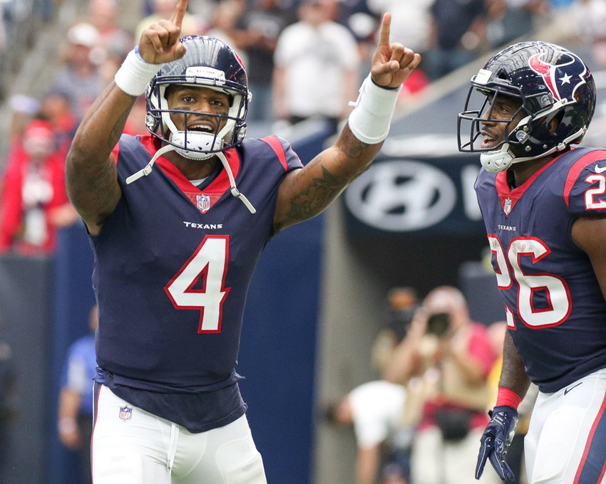 Houston Texans quarterback Deshaun Watson (4) and running back Lamar Miller (26) celebrate a touchdown during the second quarter of an NFL game between the Houston Texans and the Tennessee Titans at NRG Stadium in Houston, Texas.