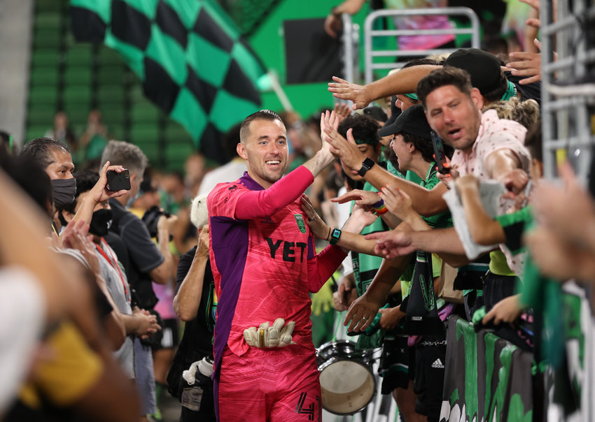 Austin FC goalkeeper Brad Stuver (41) greets fans in the supporters section after a Major League Soccer match between Austin FC and the Columbus Crew on June 27, 2021 in Austin, Texas. The teams played to a 0-0 draw.