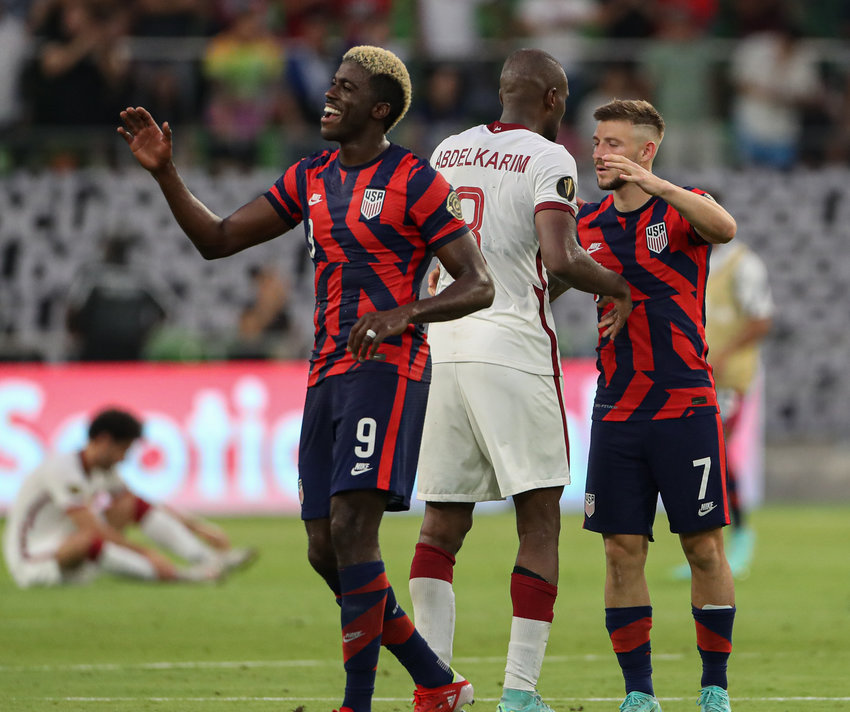 United States forward GYASI ZARDES (9) and midfielder PAUL ARRIOLA (7) celebrate a 1-0 victory over Qatar in a Concacaf Gold Cup semifinal on July 29, 2021 in Austin, Texas. The United States won 1-0. Arriola scored the lone goal in the match.