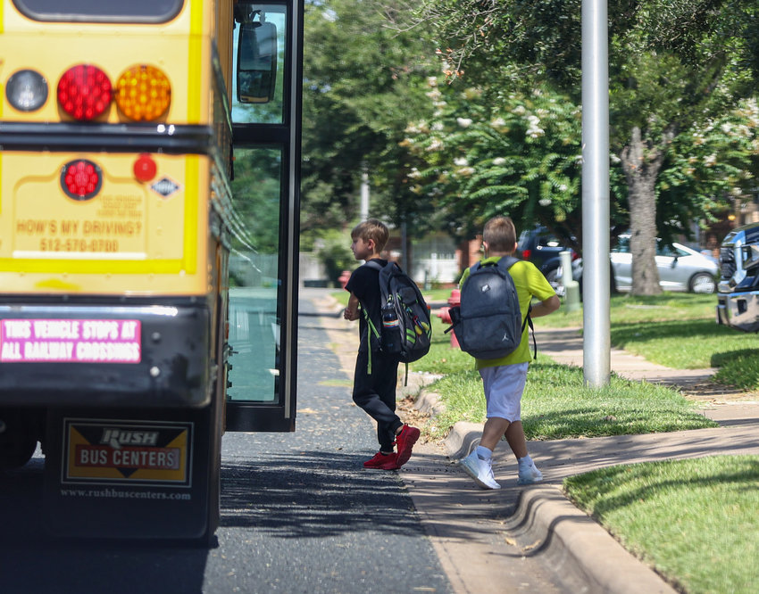 A Leander ISD bus drops children off after school in Cedar Park, Texas on Friday, August 13, 2021.