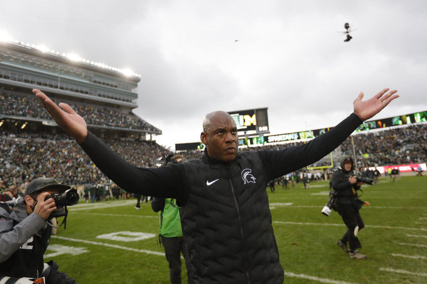 Michigan State head coach Mel Tucker celebrates as he leaves the field following a 37-33 win against Michigan at Spartan Stadium in East Lansing, Michigan, on Oct. 30, 2021. (Junfu Han/Detroit Free Press/TNS)