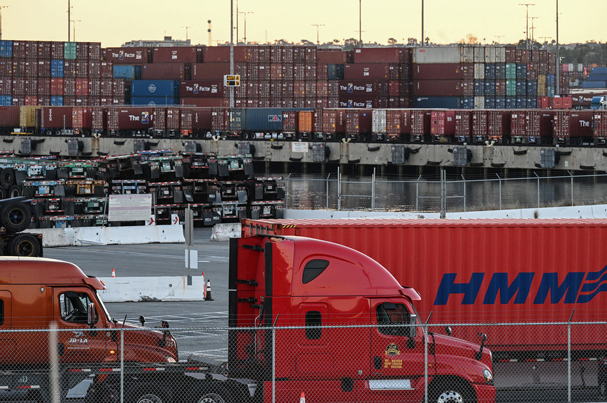 Trucks wait in long, slow-moving lines to collect containers full of products, at the Port of Los Angeles in San Pedro, California, Nov. 11, 2021. (Robyn Beck/AFP via Getty Images/TNS)