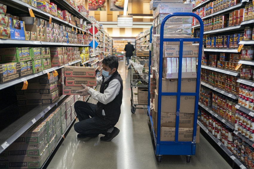 A worker stocks the shelves at Pete's Fresh Market in Chicago on Nov. 13, 2020. (Youngrae Kim/Chicago Tribune/TNS)