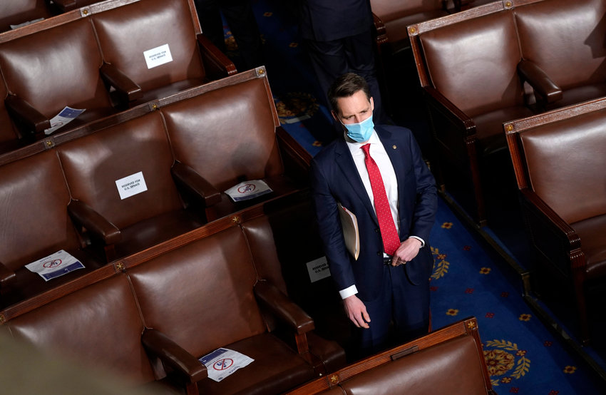 U.S. Sen. Josh Hawley, R-Mo., sits in the House Chamber before a joint session of congress on Jan. 6, 2021, in Washington, D.C. (Drew Angerer/Getty Images/TNS)