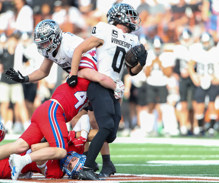 Vandegrift Vipers senior running back Ryan Sheppard (0) is stopped for a loss during a high school football playoff game between Westlake and Vandegrift on December 4, 2021 in Austin, Texas.