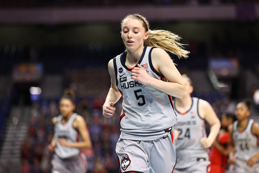 Connecticut's Paige Bueckers (5) runs off of the court after a loss to Arizona in the Final Four semifinal of the NCAA 's Tournament at the Alamodome on April 2, 2021, in San Antonio, Texas. (Elsa/Getty Images/TNS)