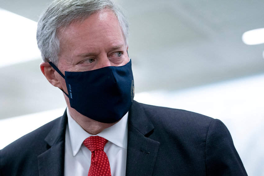 Former White House chief of staff Mark Meadows wears a protective mask as he departs the Senate Republican policy luncheon in the Hart Senate Office Building on Capitol Hill on Oct. 21, 2020, in Washington, D.C. The Jan. 6 committee will vote Monday on whether to recommend that Meadows be held in contempt of Congress. (Stefani Reynolds/Getty Images/TNS)