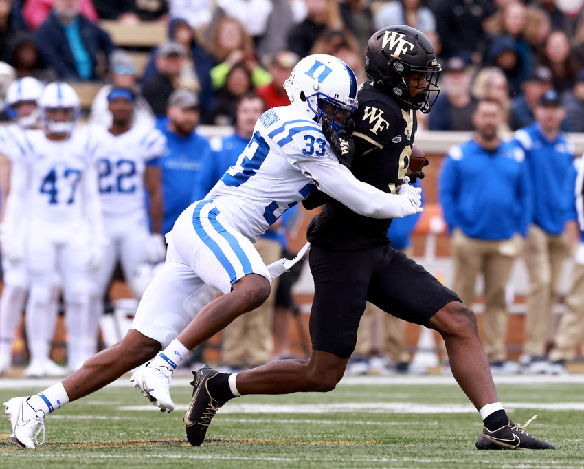 Wake Forest wide receiver A.T. Perry (9) makes a catch against Duke defensive back Leonard Johnson (33) at Truist Field on Oct. 30, 2021, in Winston-Salem, North Carolina. (Grant Halverson/Getty Images/TNS)