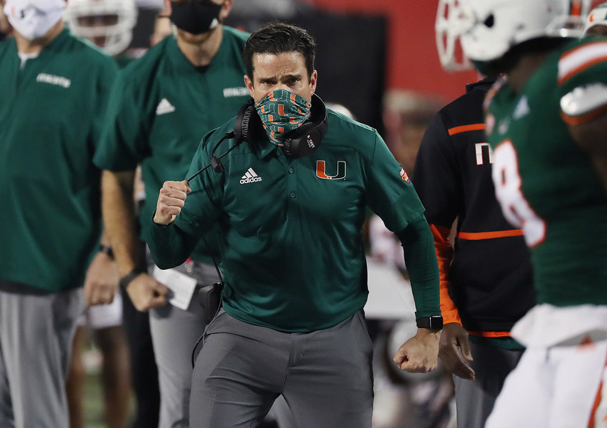 Miami head coach Manny Diaz celebrates during the Cheez-It Bowl against Oklahoma State at Camping World Stadium in Orlando, Florida, on Dec. 29, 2020. (Stephen M. Dowell/Orlando Sentinel/TNS)