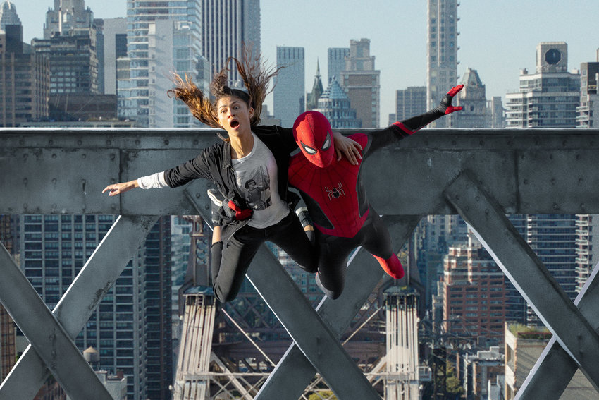 MJ (Zendaya) and Spider-Man (Tom Holland) jump off a bridge in &quot;Spider-Man: No Way Home.&quot; (Matt Kennedy/Sony Pictures/TNS)