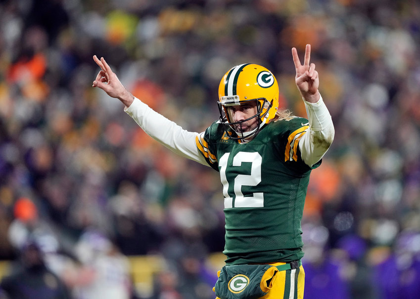 Quarterback Aaron Rodgers (12) of the Green Bay Packers celebrates after a touchdown during the 3rd quarter of the game against the Minnesota Vikings at Lambeau Field on January 02, 2022, in Green Bay, Wisconsin. (Patrick McDermott/Getty Images/TNS)