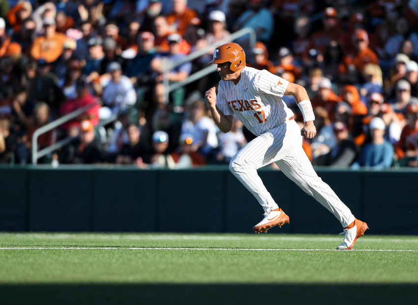 Texas first baseman IVAN MELENDEZ (17) takes off for second base during an NCAA baseball game against Rice on Feb. 19, 2022 in Austin, Texas.