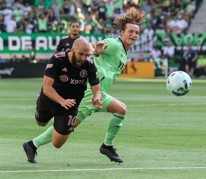 Austin FC defender Kipp Keller (15) is called for a foul against Inter Miami forward Gonzalo Higuain (10) during a Major League Soccer match on March 6, 2021 in Austin, Texas.