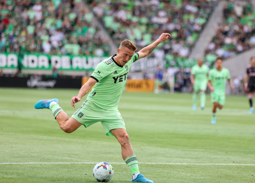 Austin FC midfielder Alexander Ring (8) lines up a pass that for an assist on a goal by forward Maximiliano Urruti (37) during a Major League Soccer match against Inter Miami on March 6, 2021 in Austin, Texas.
