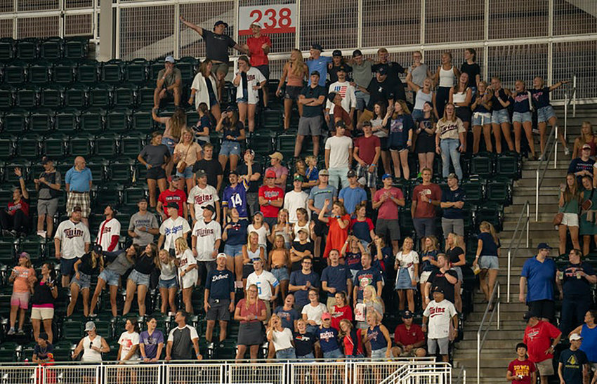 Minnesota Twins fans stand and sing &quot;Take Me Out to The Ball Game&quot; during the seventh-inning stretch of a game against the Detroit Tigers. (Jeff Wheeler/Minneapolis Star Tribune/TNS)