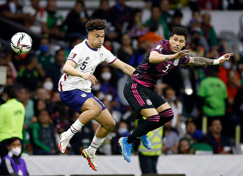 United States defender Miles Robinson (5) and Mexico defender Jorge Sanchez (3) in the first half at Estadio Azteca on Thursday, March 24, 2022, in Mexico City. U.S. Men's National Team's FIFA World Cup Qualifying soccer match against Mexico. Qualifier to the FIFA World Cup Qatar 2022. (Gary Coronado/Los Angeles Times/TNS)