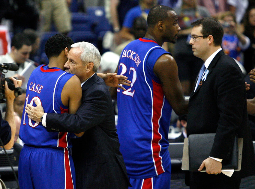 Kansas guard Jeremy Case receives a hug from North Carolina head coach Roy Williams after the Jayhawks defeated the Tar Heels 84-66, during a semi-final game in the NCAA Men's Basketball Championship Final Four at the Alamodome in San Antonio, Texas, Saturday, April 5, 2008. (Rich Sugg/Kansas City Star/TNS)