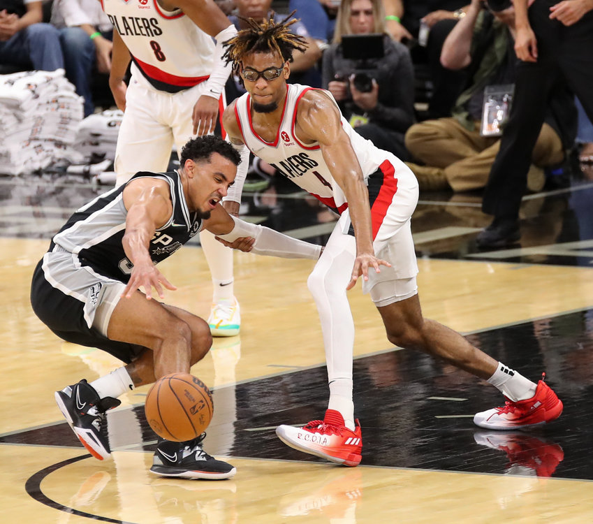 Portland Trail Blazers forward GREG BROWN III (4) defends against San Antonio Spurs guard TRE JONES (33) during an NBA game between the Spurs and the Trail Blazers on April 3, 2022 in San Antonio, Texas. The Spurs won, 113-92.