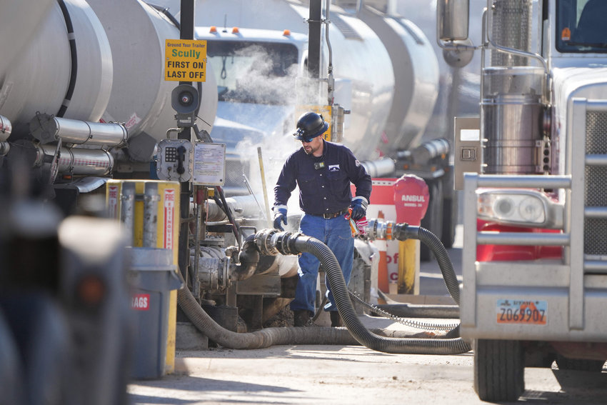 Oil tankers drop off crude oil to be refined into gas at the Marathon Oil Refinery in Salt Lake City, Utah, on Oct. 29, 2021. Inflation has had a disparate effect on companies, as will be seen in earnings reports beginning in the coming week. (George Frey/AFP/Getty Images/TNS)