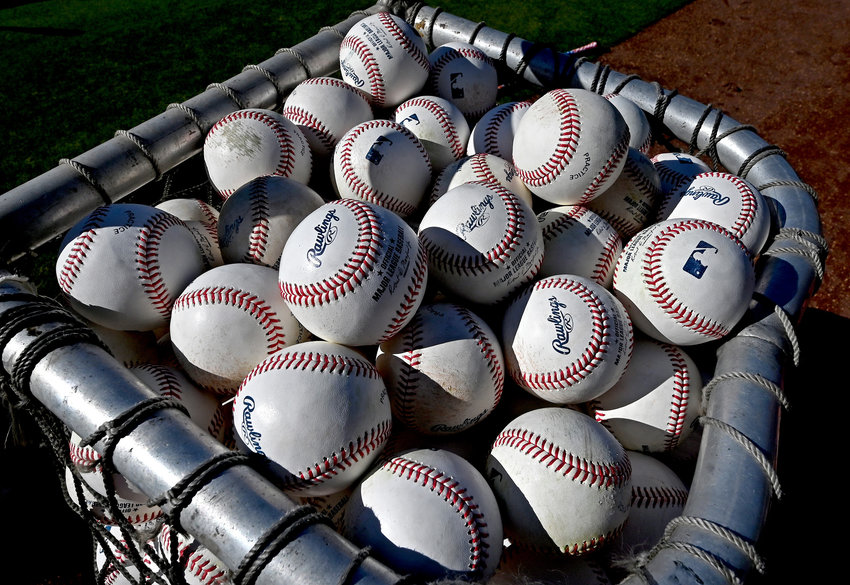 A detailed view of baseballs used for batting practice before a game between the Los Angeles Dodgers and the Houston Astros at Dodger Stadium on Aug. 3, 2021, in Los Angeles. (Jayne Kamin-Oncea/Getty Images/TNS)