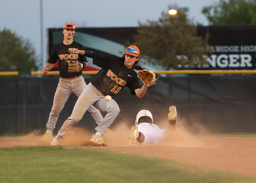 Vista Ridge sophomore Kade Nathman (1) steals second base as the throw to Westwood senior Gael Garcia (11) is late during a high school baseball game on April 8, 2022 in Cedar Park, Texas.