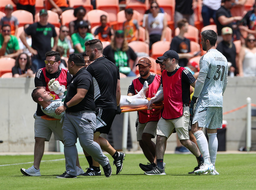 Austin FC goalkeeper Brad Stuver (1) is taken off the pitch on a stretcher after sustaining an injury in the first half of a Major League Soccer match between the Houston Dynamo and Austin FC on April 30, 2022 in Houston, Texas.