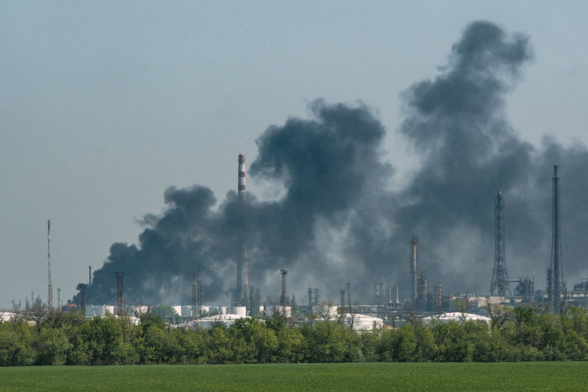 A smoke after shelling rises from an oil refinary near Lysychansk, eastern Ukraine, on May 9, 2022, on the 75th day of the Russian invasion of Ukraine. (Yasuyoshi Chiba/AFP via Getty Images/TNS)