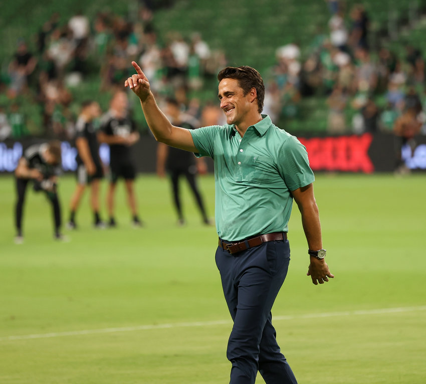 Austin FC head coach Josh Wolff gestures to the fans following a 3-1 win over the Portland Timbers in a Major League Soccer match on August 21, 2021 in Austin, Texas.