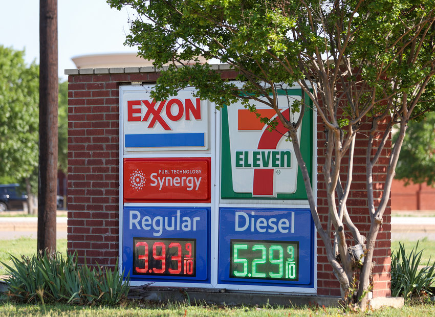 A sign at the 7-Eleven convenience store at the intersection of New Hope Drive and Bagdad Road marks the price of a gallon of regular unleaded at $3.939 and diesel at $5.299 per gallon.