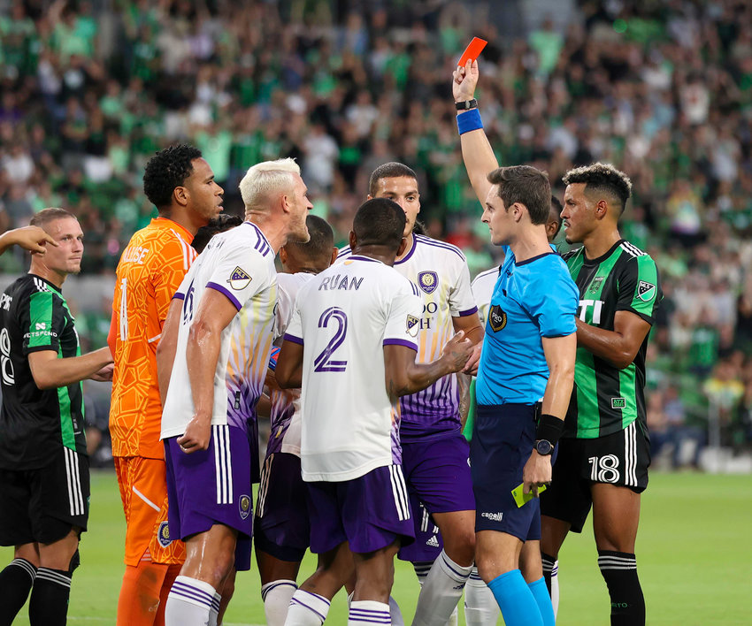 Referee Joe Dickeson shows Orlando City midfielder Cesar Araujo (5) the red card during the second half of a Major League Soccer match at Austin FC on May 22, 2022 in Austin, Texas.